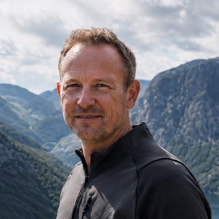 Lars Hansen, Norway tour packages specialist, photographed above a fjord in western Norway